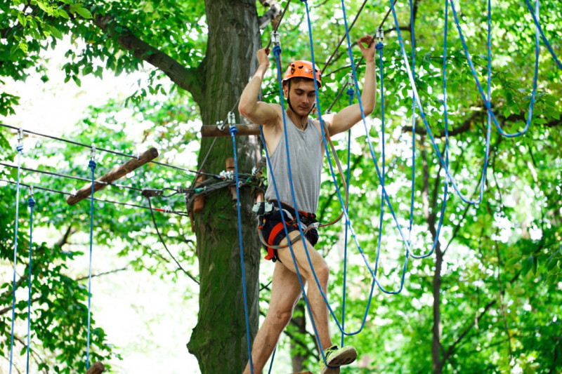 man-steps-rope-hanging-air-52804