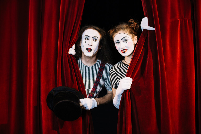two-mime-artist-peeking-through-red-curtain-free-pic-46378